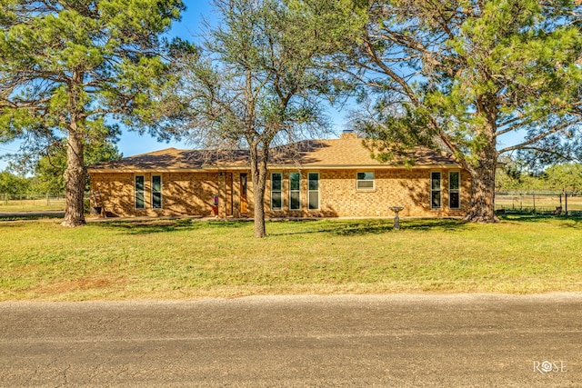 ranch-style house with a front yard