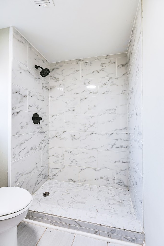 106 W 27th St, San Angelo, TX 76903 - full bathroom featuring toilet and a stall shower