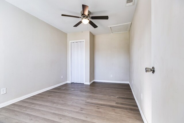 106 W 27th St, San Angelo, TX 76903 - spare room with a ceiling fan, wood finished floors, and attic access