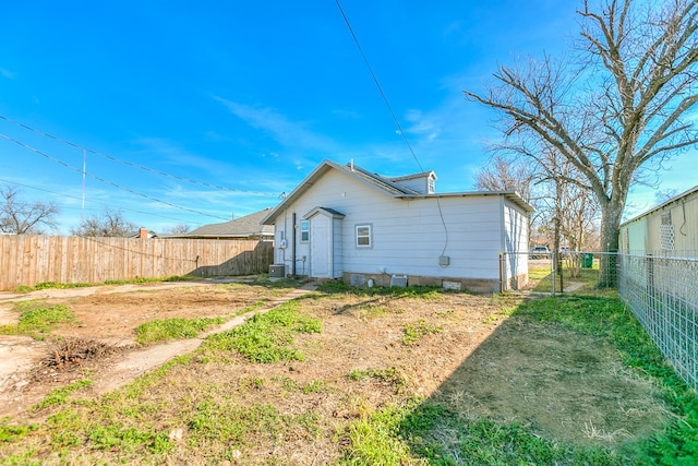 106 W 27th St, San Angelo, TX 76903 - back of house with a fenced backyard and a gate