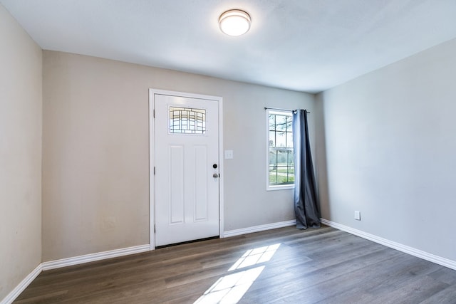 106 W 27th St, San Angelo, TX 76903 - entryway with wood finished floors and baseboards