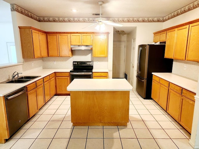 kitchen featuring a sink, light tile patterned floors, ceiling fan, appliances with stainless steel finishes, and under cabinet range hood