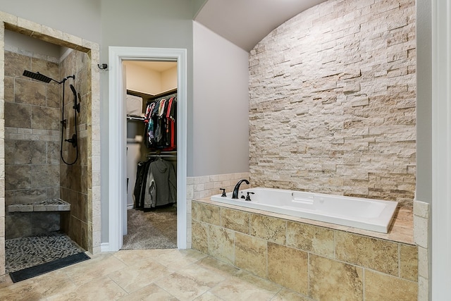 bathroom featuring plus walk in shower