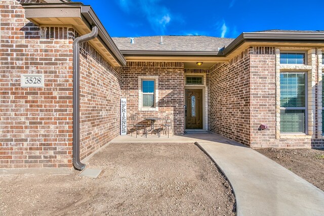 entrance to property with a patio area