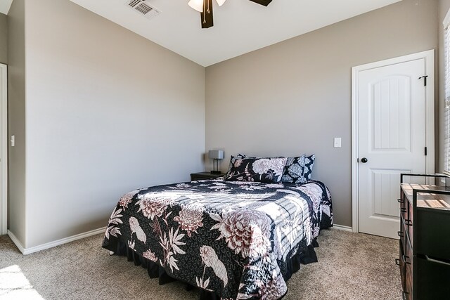 bedroom with ceiling fan and light colored carpet