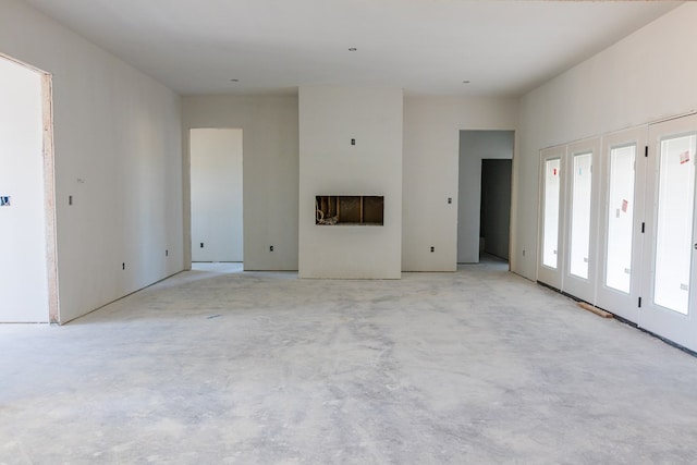 unfurnished living room featuring a fireplace