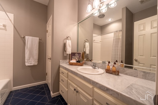 bathroom featuring vanity, tile patterned floors, and shower / bath combo