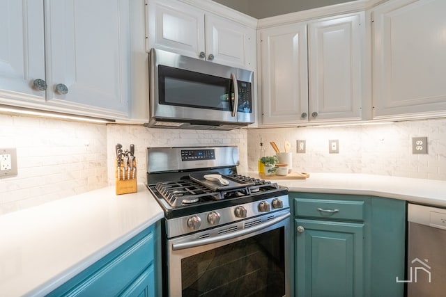 kitchen with white cabinetry, decorative backsplash, and stainless steel appliances