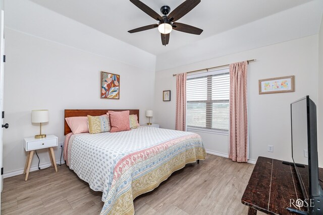 bedroom featuring light hardwood / wood-style floors and ceiling fan