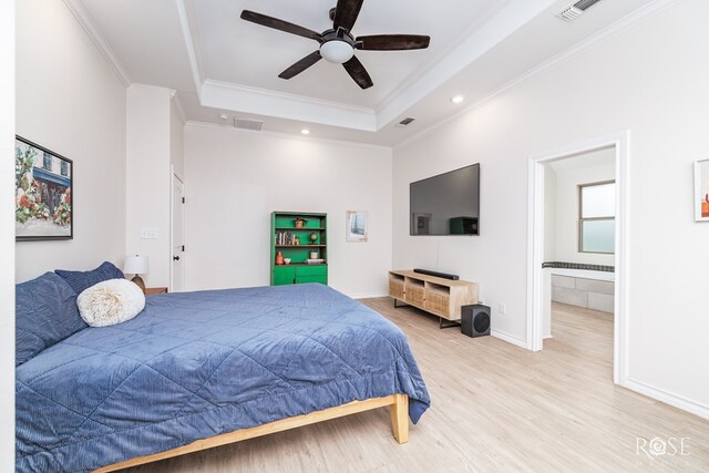 bedroom featuring ornamental molding, ceiling fan, light hardwood / wood-style floors, and a tray ceiling