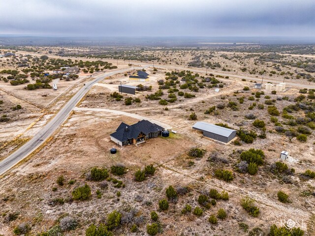 birds eye view of property featuring a rural view