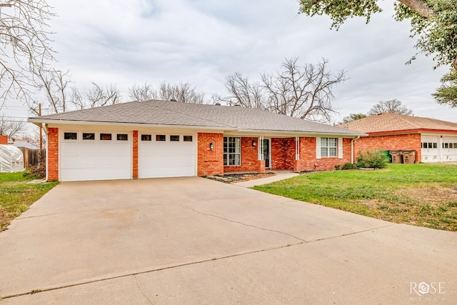 ranch-style house featuring a front lawn and a garage