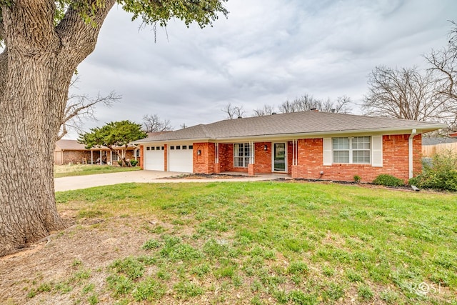 ranch-style home with a garage and a front lawn