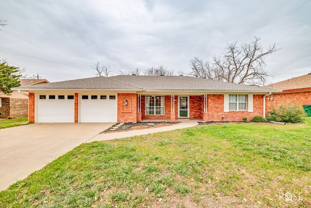 ranch-style home featuring a garage and a front lawn