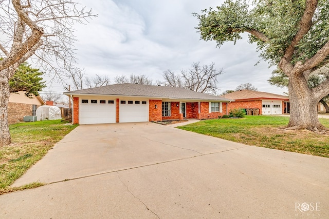 single story home featuring a front yard and a garage