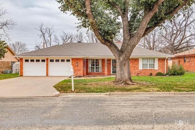 single story home with a garage and a front lawn