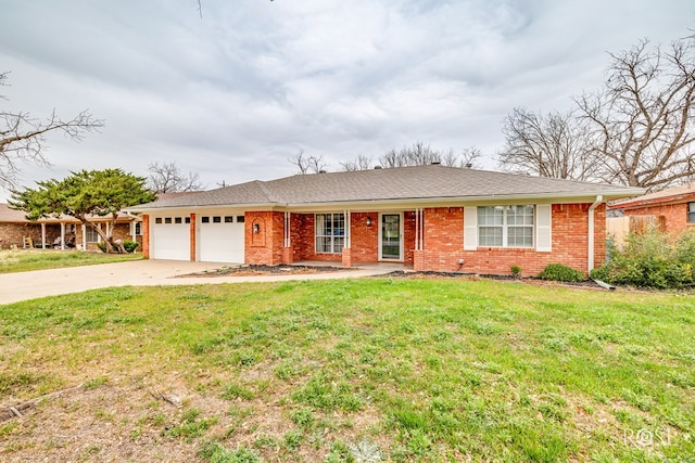 ranch-style home featuring a garage and a front lawn