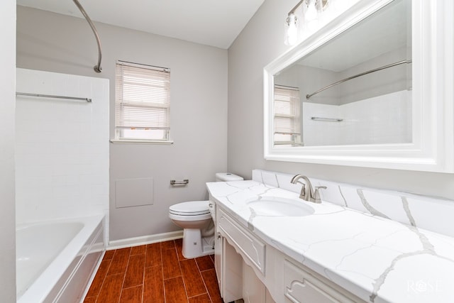 full bathroom with vanity, bathing tub / shower combination, and toilet