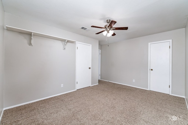 unfurnished room featuring carpet floors and ceiling fan