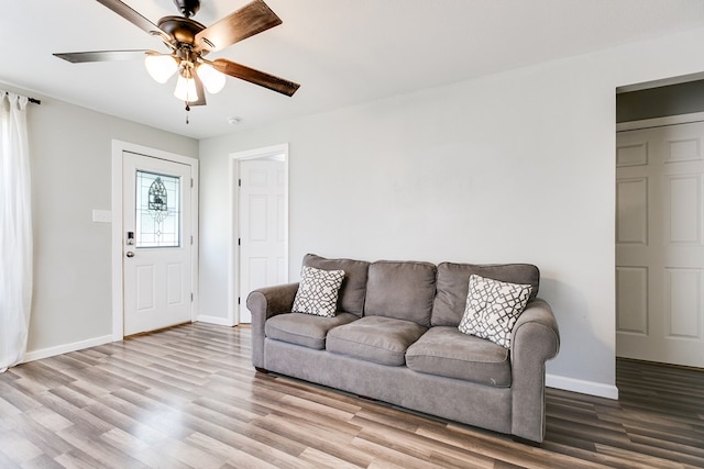419 N Emerson St, San Angelo, TX 76903 - living room featuring wood finished floors, baseboards, and a ceiling fan