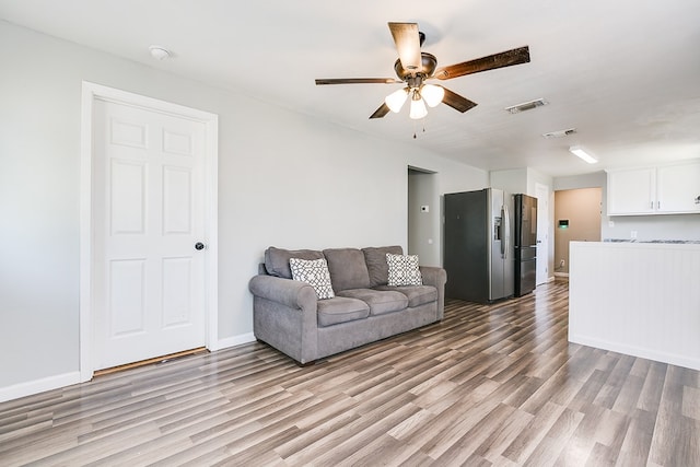 419 N Emerson St, San Angelo, TX 76903 - living room featuring light wood-style flooring, ceiling fan, and baseboards