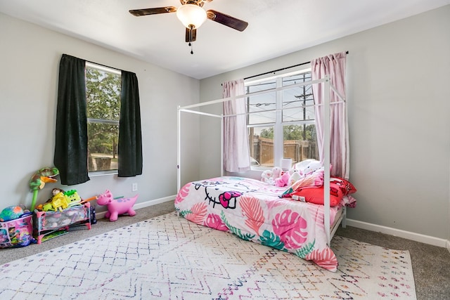 419 N Emerson St, San Angelo, TX 76903 - carpeted bedroom with baseboards and ceiling fan