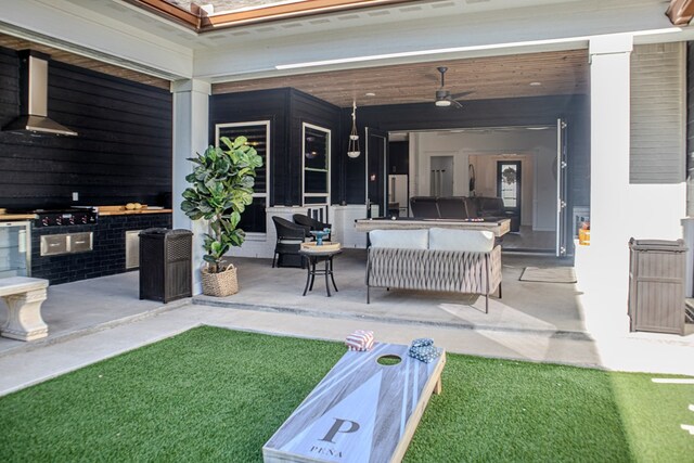 view of patio featuring an outdoor hangout area and ceiling fan