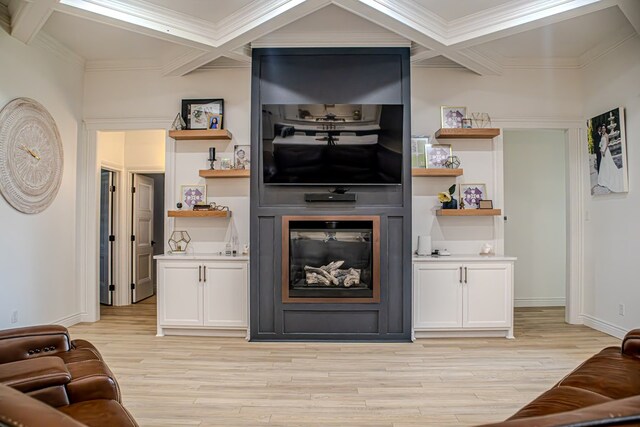 living room with coffered ceiling, crown molding, and light wood-type flooring