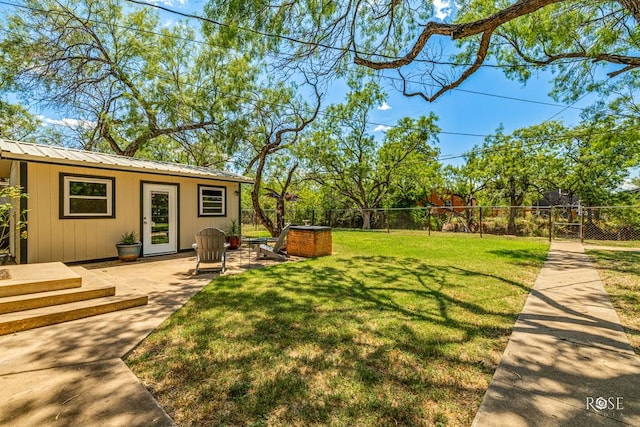 view of yard featuring fence and a patio area