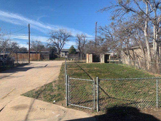 exterior space featuring a front yard and a storage unit