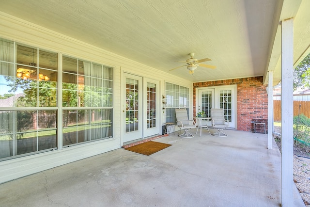 view of patio with ceiling fan and fence