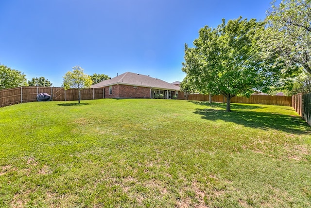 view of yard featuring a fenced backyard