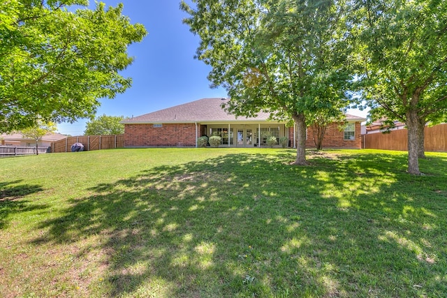 view of yard with a fenced backyard