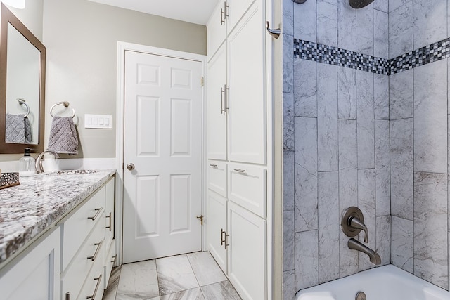 bathroom with vanity and bathing tub / shower combination