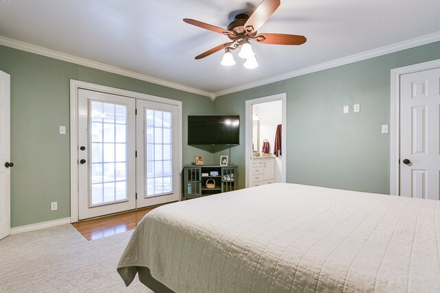 bedroom featuring ceiling fan, ornamental molding, access to exterior, and connected bathroom