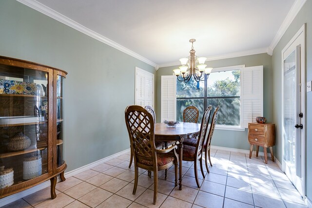 dining room with crown molding, a notable chandelier, and light tile patterned floors