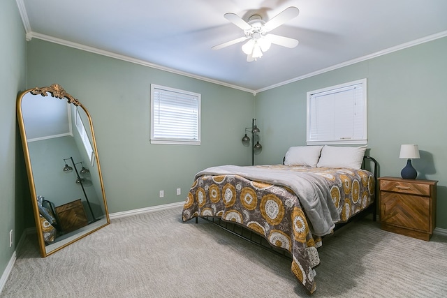 carpeted bedroom featuring ceiling fan and ornamental molding