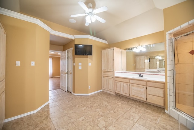 bathroom with lofted ceiling, a stall shower, vanity, and baseboards