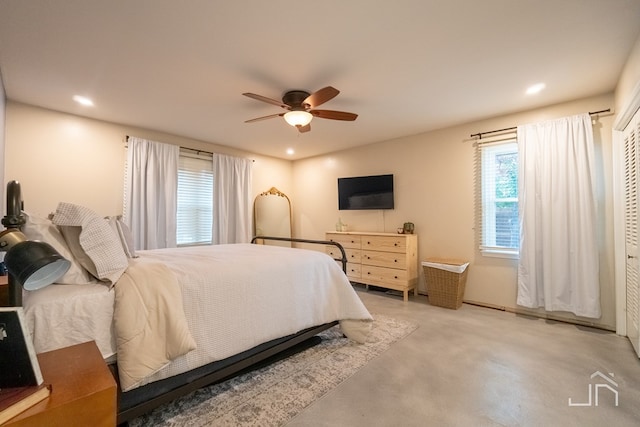 bedroom with ceiling fan and a closet