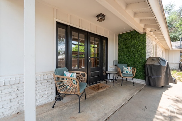 view of exterior entry featuring french doors