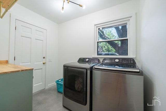 clothes washing area featuring washing machine and clothes dryer