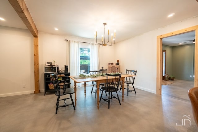 dining space with beamed ceiling, concrete flooring, and a chandelier