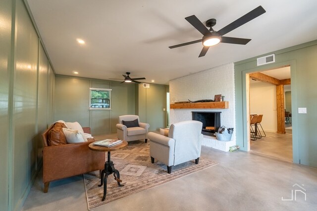 living room featuring a brick fireplace