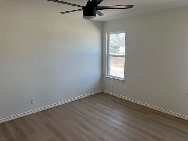 unfurnished room featuring light hardwood / wood-style flooring and ceiling fan