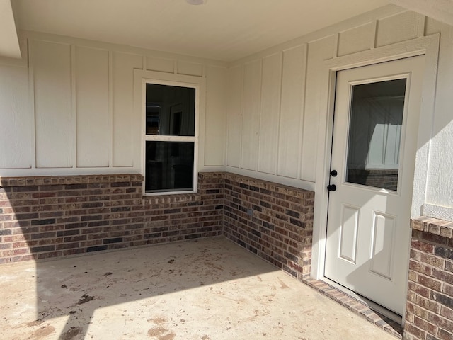 property entrance with a patio area