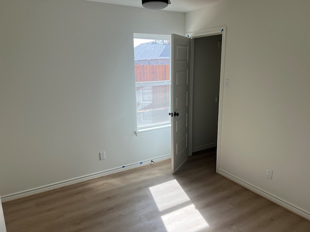 unfurnished room featuring light wood-type flooring