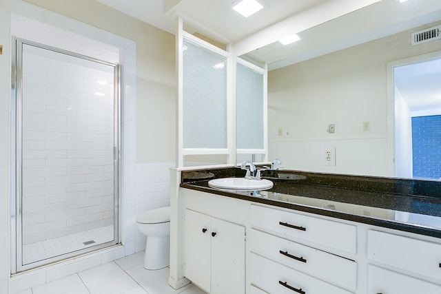 2472-D University Ave, San Angelo, TX 76904 - full bathroom with toilet, a stall shower, tile patterned flooring, and vanity