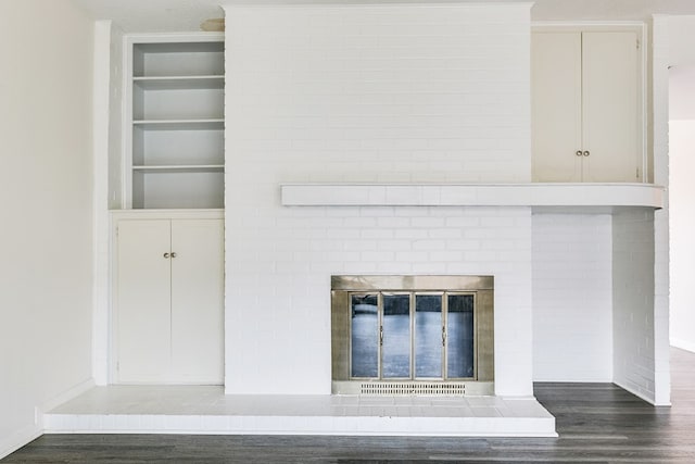 2472-D University Ave, San Angelo, TX 76904 - detailed view of wood finished floors, built in features, a fireplace, and baseboards