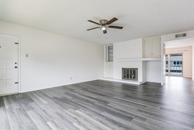 2472-D University Ave, San Angelo, TX 76904 - unfurnished living room featuring ceiling fan, wood finished floors, and a glass covered fireplace