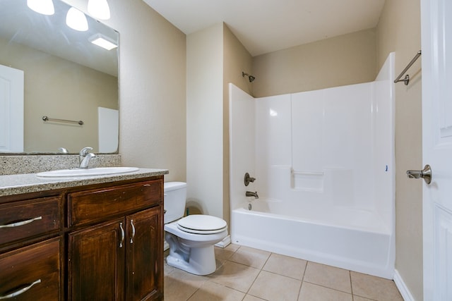 bathroom featuring washtub / shower combination, tile patterned flooring, vanity, and toilet